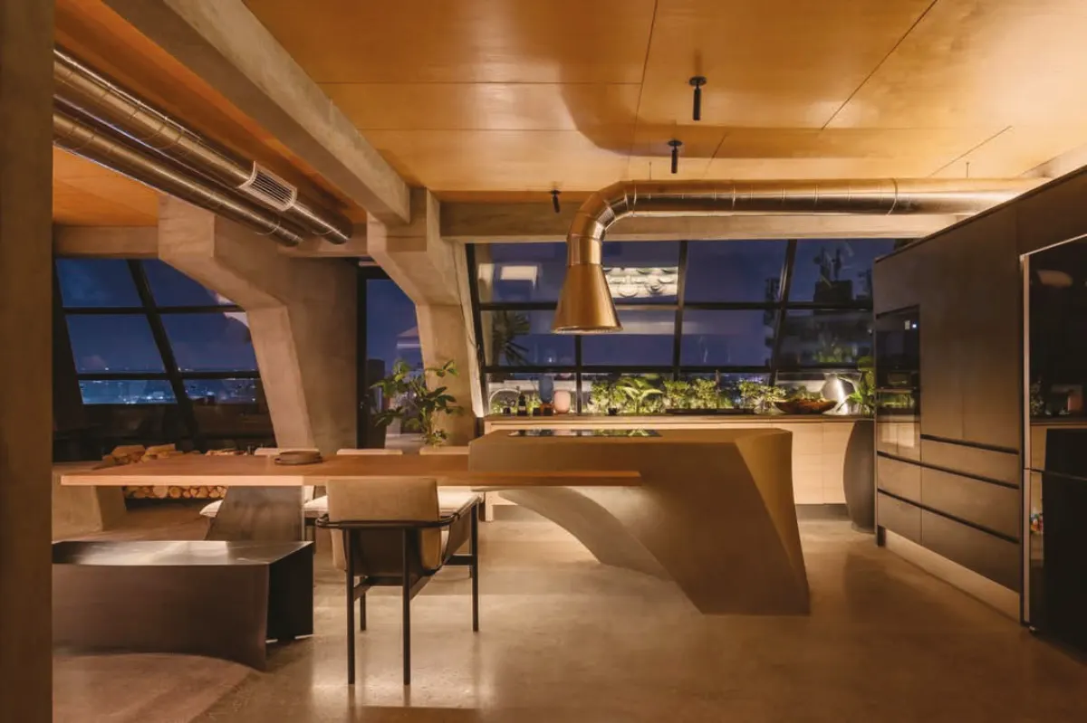 Sculpted kitchen island in a warm modern interior