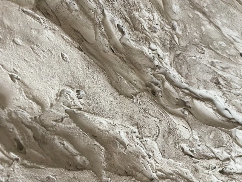 Close-up of a rough stone-effect surface finish